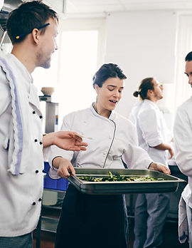 Chefs Discussing over Food